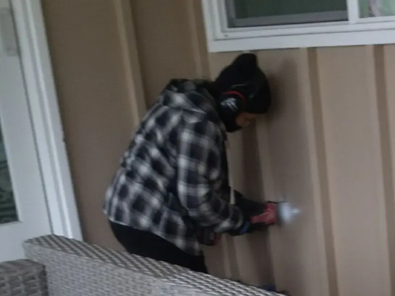 Professional electrician installing an exterior outlet in Macon
